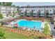 Relax by the community pool, surrounded by comfortable lounge chairs and sun umbrellas at 2032 Holtz Ln, Atlanta, GA 30318