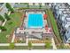 A bird's-eye view of a community pool offering sun loungers, umbrellas, and a stylish pool house at 2032 Holtz Ln, Atlanta, GA 30318