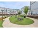 Serene community space featuring picnic tables, lush greenery, and well-maintained walkways at 2032 Holtz Ln, Atlanta, GA 30318