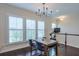 Dining area with chandelier and shutters featuring a view of a Peloton exercise bike at 2032 Holtz Ln, Atlanta, GA 30318