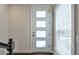 Bright entryway featuring a white door with glass panes and a window with blinds at 2032 Holtz Ln, Atlanta, GA 30318