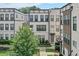 Beautiful new construction townhome with modern white and grey design and manicured landscaping at 2032 Holtz Ln, Atlanta, GA 30318