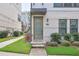 Close up of a home's front door with a modern design and manicured landscaping at 2032 Holtz Ln, Atlanta, GA 30318