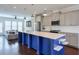Open concept kitchen with a large island, stainless steel appliances, and hardwood floors at 2032 Holtz Ln, Atlanta, GA 30318