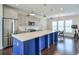A kitchen with a large center island and open to a dining area at 2032 Holtz Ln, Atlanta, GA 30318
