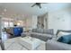 Open-concept living room flowing into the kitchen with modern decor and hardwood floors at 2032 Holtz Ln, Atlanta, GA 30318