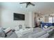 Open-concept living room flowing into the kitchen with hardwood floors and modern decor at 2032 Holtz Ln, Atlanta, GA 30318