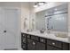 This bathroom features a double sink vanity with an oversized mirror and a separate water closet at 2032 Holtz Ln, Atlanta, GA 30318