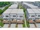 View of the rear of modern townhomes, each featuring a private deck or patio space at 2032 Holtz Ln, Atlanta, GA 30318
