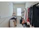 Organized walk-in closet with ample shelving and storage space, offering a neat solution at 2032 Holtz Ln, Atlanta, GA 30318