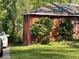 Brick exterior of home, showing side with some greenery and a parked car at 2216 Polar Rock Sw Ave, Atlanta, GA 30315