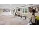 Spacious basement area outfitted with exercise equipment and natural light at 11165 Bentley Chase Dr, Johns Creek, GA 30097