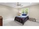 Neutral bedroom with carpet and a single bed under a window at 11165 Bentley Chase Dr, Johns Creek, GA 30097