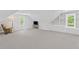Spacious bonus room with natural light, built-in shelving and cabinets at 11165 Bentley Chase Dr, Johns Creek, GA 30097