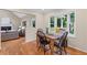 Inviting breakfast nook features a bay window with bench seating and hardwood flooring at 11165 Bentley Chase Dr, Johns Creek, GA 30097