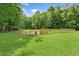 Well-maintained community dog park with fencing and greenery in a natural setting at 11165 Bentley Chase Dr, Johns Creek, GA 30097