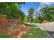 Community entrance to Parsons Run with brick signage, landscaping and manicured lawn at 11165 Bentley Chase Dr, Johns Creek, GA 30097