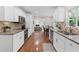 Modern kitchen featuring stainless steel appliances, granite countertops, and a stylish backsplash at 11165 Bentley Chase Dr, Johns Creek, GA 30097