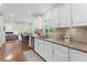 Modern kitchen featuring stainless steel appliances, granite countertops, and a stylish backsplash at 11165 Bentley Chase Dr, Johns Creek, GA 30097