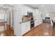 Modern kitchen featuring stainless steel appliances, granite countertops, and hardwood floors at 11165 Bentley Chase Dr, Johns Creek, GA 30097