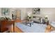 Inviting living room with hardwood floors, a stylish rug, and comfortable seating, perfect for relaxation and entertainment at 11165 Bentley Chase Dr, Johns Creek, GA 30097