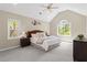 Large main bedroom features vaulted ceiling, neutral walls, carpet, and lots of natural light at 11165 Bentley Chase Dr, Johns Creek, GA 30097