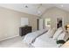Spacious main bedroom with vaulted ceiling, neutral walls, and large windows offering natural light at 11165 Bentley Chase Dr, Johns Creek, GA 30097