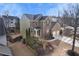 A charming home with lush landscaping, a two-car garage, and a welcoming entrance, captured from above at 213 Roseman Way, Woodstock, GA 30188