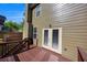View of the back deck area features a wooden railing and steps down into the back yard at 213 Roseman Way, Woodstock, GA 30188