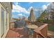 Spacious wooden deck has seating area, ideal for outdoor relaxation or entertaining with natural view at 213 Roseman Way, Woodstock, GA 30188