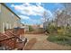 Backyard featuring a deck, lush lawn, and mature trees, creating a private outdoor space at 213 Roseman Way, Woodstock, GA 30188