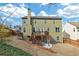 View of the home's backyard, deck, and patio area at 213 Roseman Way, Woodstock, GA 30188