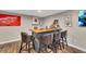 Finished basement bar area features gray cabinets, ample liquor storage, and comfortable seating at 213 Roseman Way, Woodstock, GA 30188