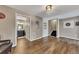 Spacious basement features wood flooring, a bathroom, and stairs to another floor at 213 Roseman Way, Woodstock, GA 30188