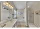 Bright bathroom with double sinks, a soaking tub, and a glass-enclosed shower offers style and functionality at 213 Roseman Way, Woodstock, GA 30188