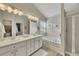 Luxurious bathroom offers double sinks, soaking tub, and separate glass shower for relaxation at 213 Roseman Way, Woodstock, GA 30188