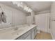 Bright bathroom features a double sink vanity with stylish lighting and neutral tones at 213 Roseman Way, Woodstock, GA 30188
