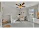 Neutral bedroom with crib, rocking chair, and window at 213 Roseman Way, Woodstock, GA 30188