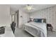 Neutral bedroom with light gray carpet, desk space, and a ceiling fan at 213 Roseman Way, Woodstock, GA 30188