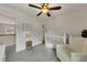 Neutral bedroom with crib, rocking chair, and window at 213 Roseman Way, Woodstock, GA 30188