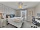 Cozy bedroom with floral accent wall, plush carpet, and ample natural light at 213 Roseman Way, Woodstock, GA 30188