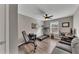 Bedroom/Gym features wood flooring, a ceiling fan, and large window at 213 Roseman Way, Woodstock, GA 30188