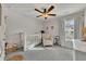 Bedroom features plush carpet, ceiling fan, and natural light from the window at 213 Roseman Way, Woodstock, GA 30188
