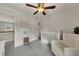 Cozy Bedroom features plush carpet, chair, and crib at 213 Roseman Way, Woodstock, GA 30188