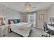 Stylish bedroom showcases modern wallpaper, neutral carpet, and functional workspace for comfort and productivity at 213 Roseman Way, Woodstock, GA 30188