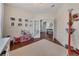 Cozy bedroom with a view to the foyer through French doors and natural light at 213 Roseman Way, Woodstock, GA 30188