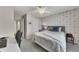 Cozy bedroom features neutral decor, soft carpet, and a functional desk space for comfortable living at 213 Roseman Way, Woodstock, GA 30188