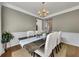 Formal dining room with a large table, seating for six, and wainscotting along the walls at 213 Roseman Way, Woodstock, GA 30188