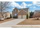 Two-story brick home with a two-car garage, complimented by a concrete driveway at 213 Roseman Way, Woodstock, GA 30188