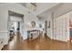 Spacious foyer featuring hardwood floors, decorative wainscotting, and an elegant console table at 213 Roseman Way, Woodstock, GA 30188
